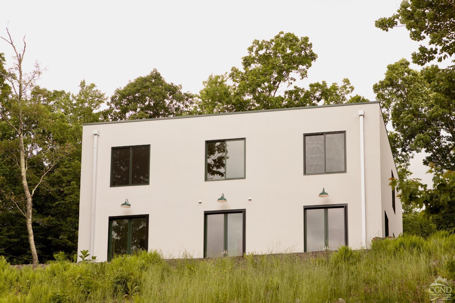 a view of house with yard