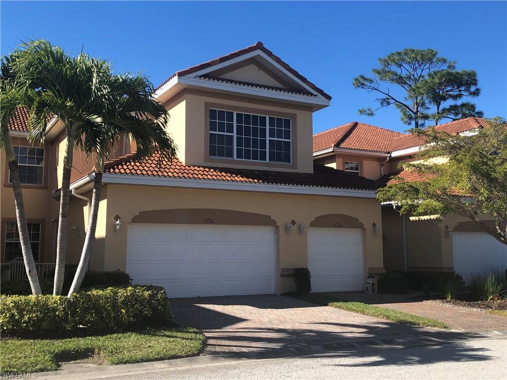 a front view of a house with garage