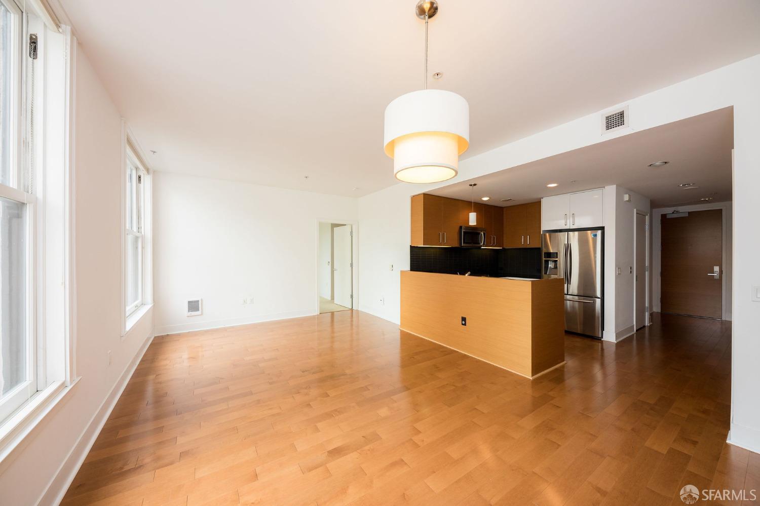 a view of a kitchen with a sink stainless steel appliances and cabinets