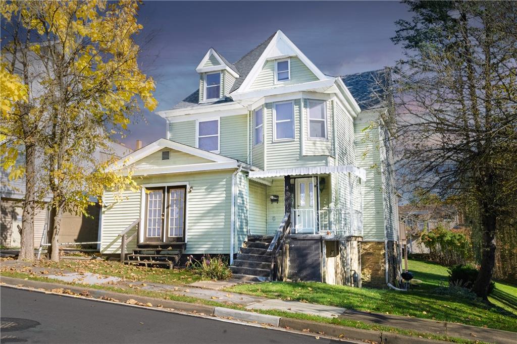 a front view of a house with a yard