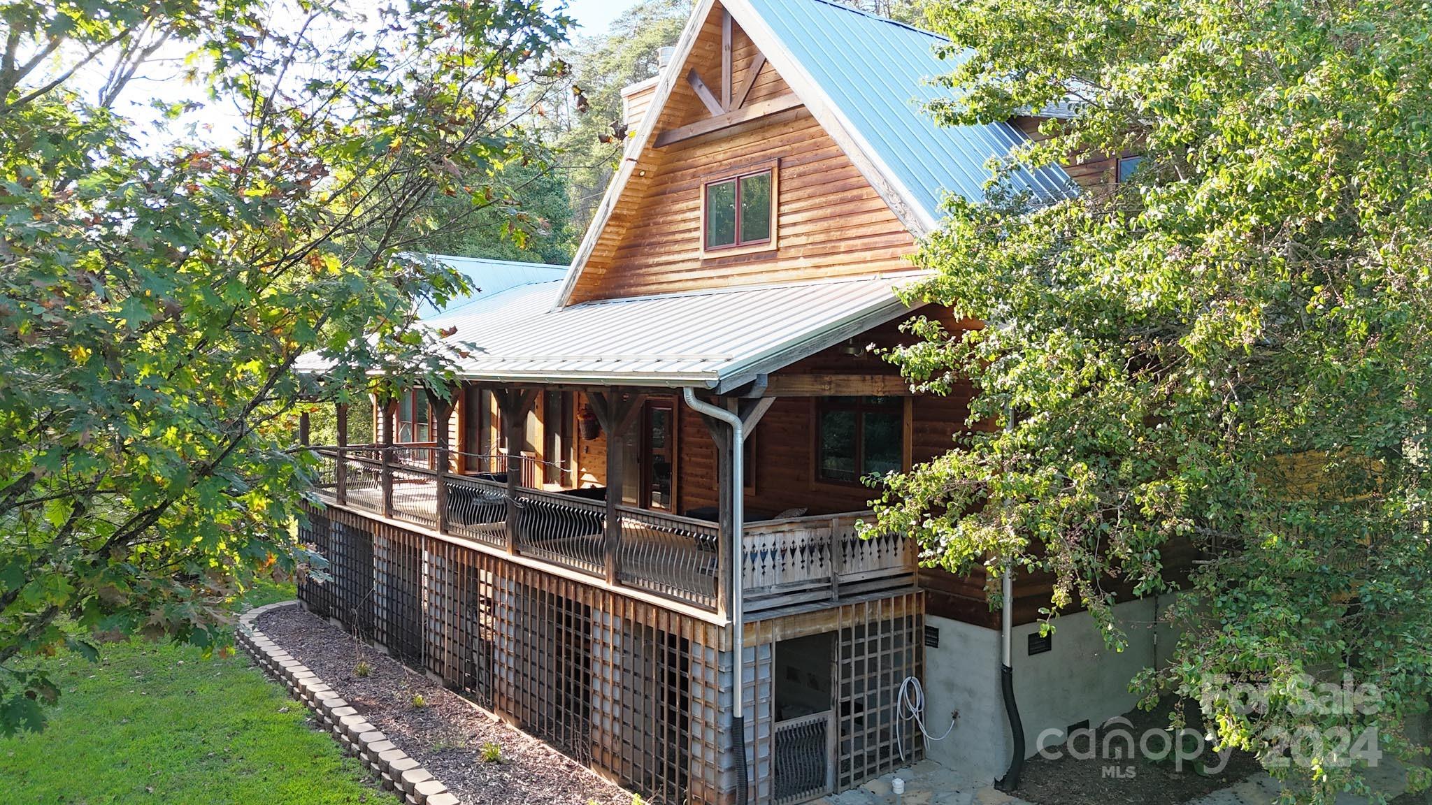 a view of house with outdoor space and trees