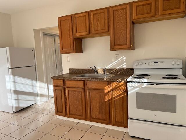 a kitchen with stainless steel appliances granite countertop a stove and a refrigerator