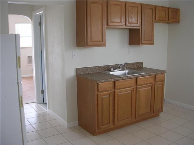 a view of cabinets and wooden floor