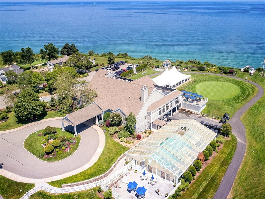 an aerial view of a house with a swimming pool