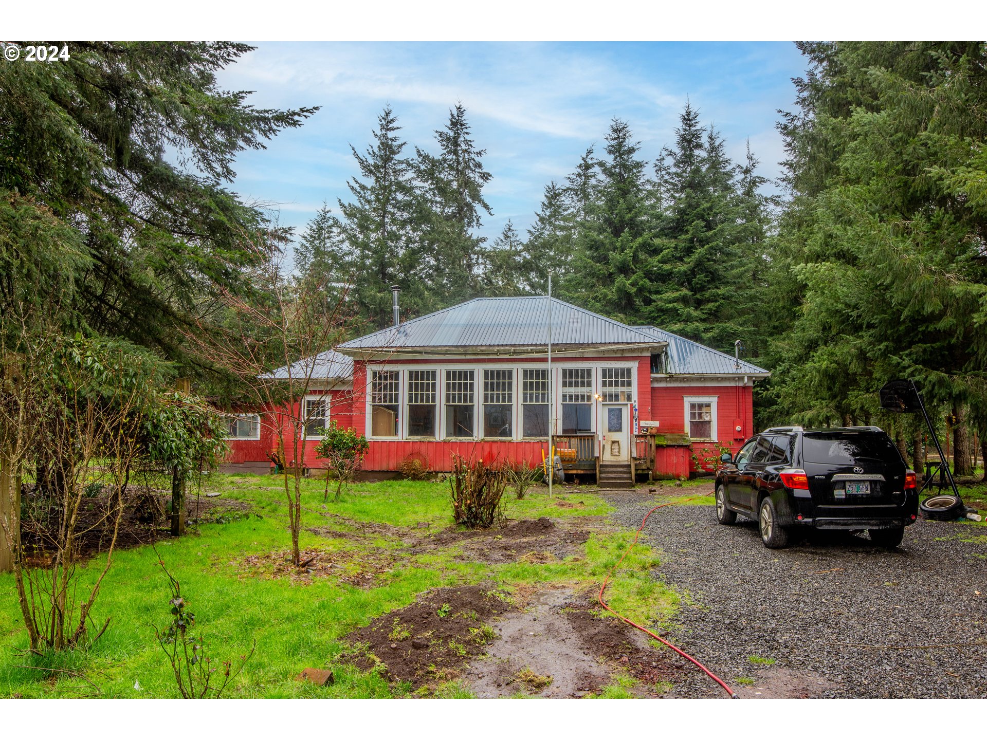 a view of front of house with a yard