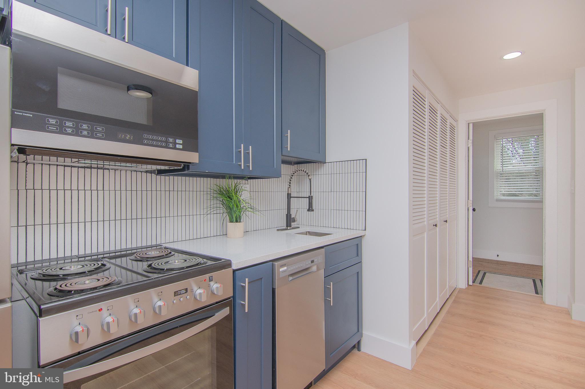 a kitchen with a stove and a microwave