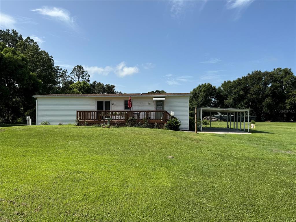 a front view of house with a garden