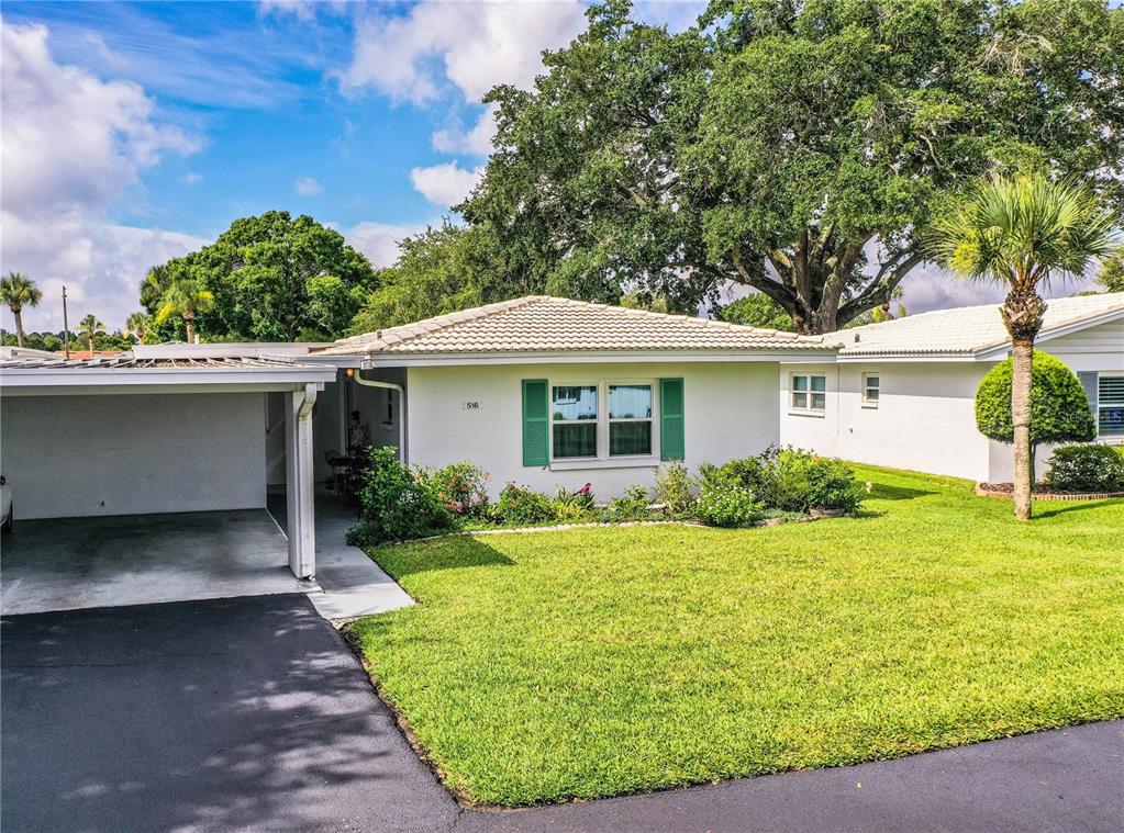 front view of a house with a yard