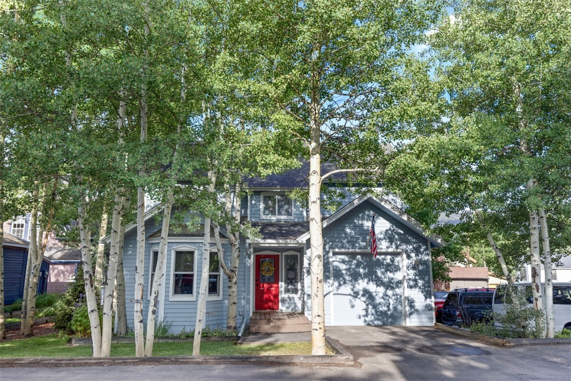 View of front of property featuring a garage