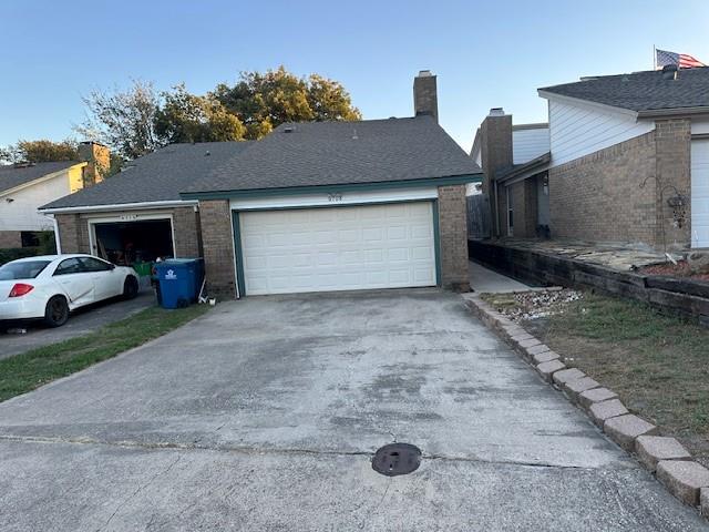 a view of a car parked in front of house