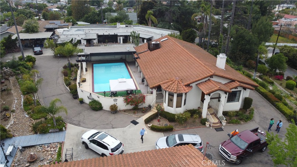 an aerial view of multiple houses with yard