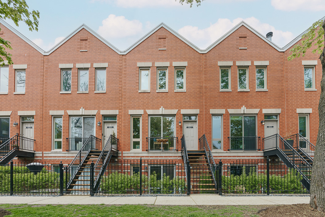 a front view of a building and a yard