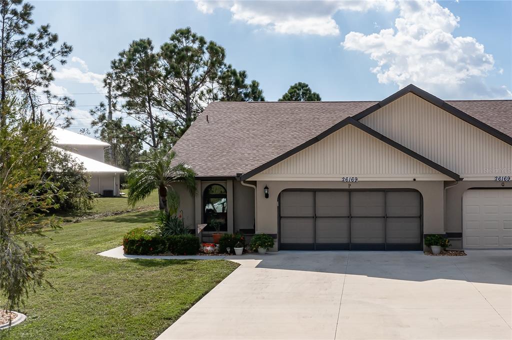 a front view of a house with a garage