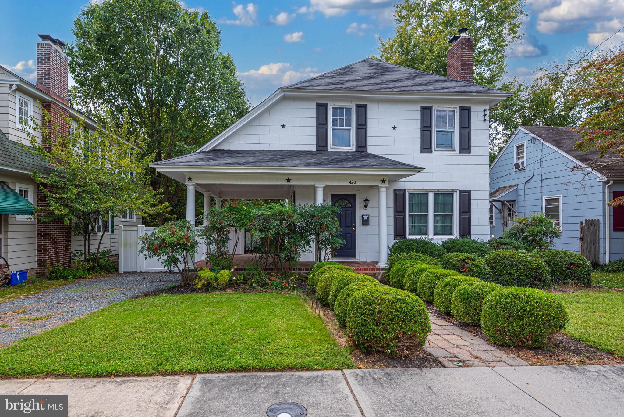 a view of a house with a yard and plants