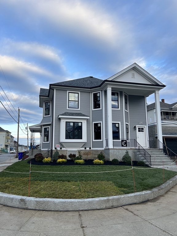 a front view of a house with a yard