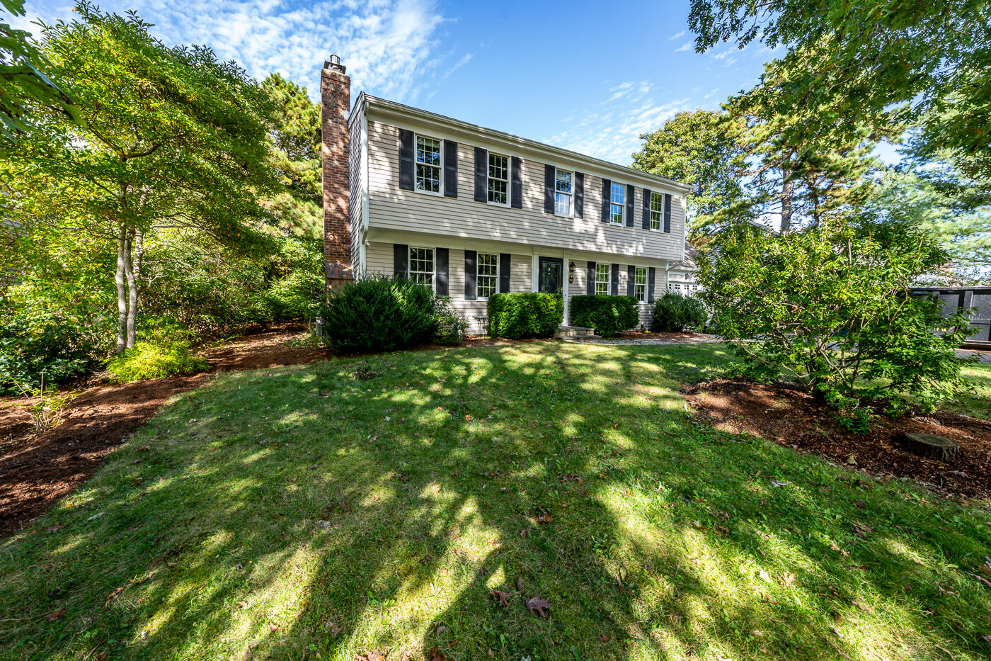 a front view of a house with a yard