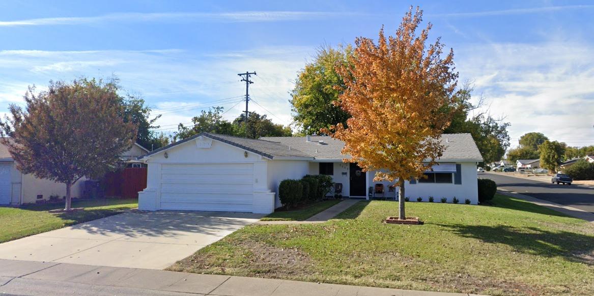 a front view of a house with a yard