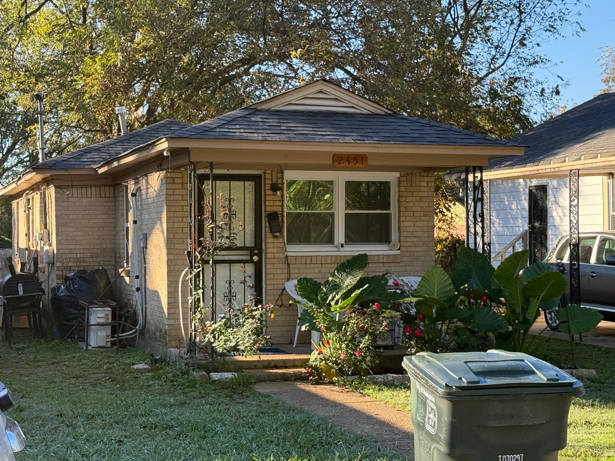 a front view of a house with garden