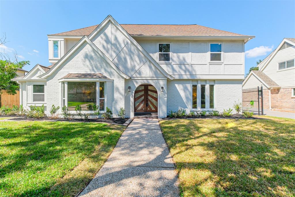 Welcome home to this meticulously redesigned Tudor-style home which blends classic architecture with high-end modern finishes, creating a captivating sanctuary in the heart of Lakeside Place.