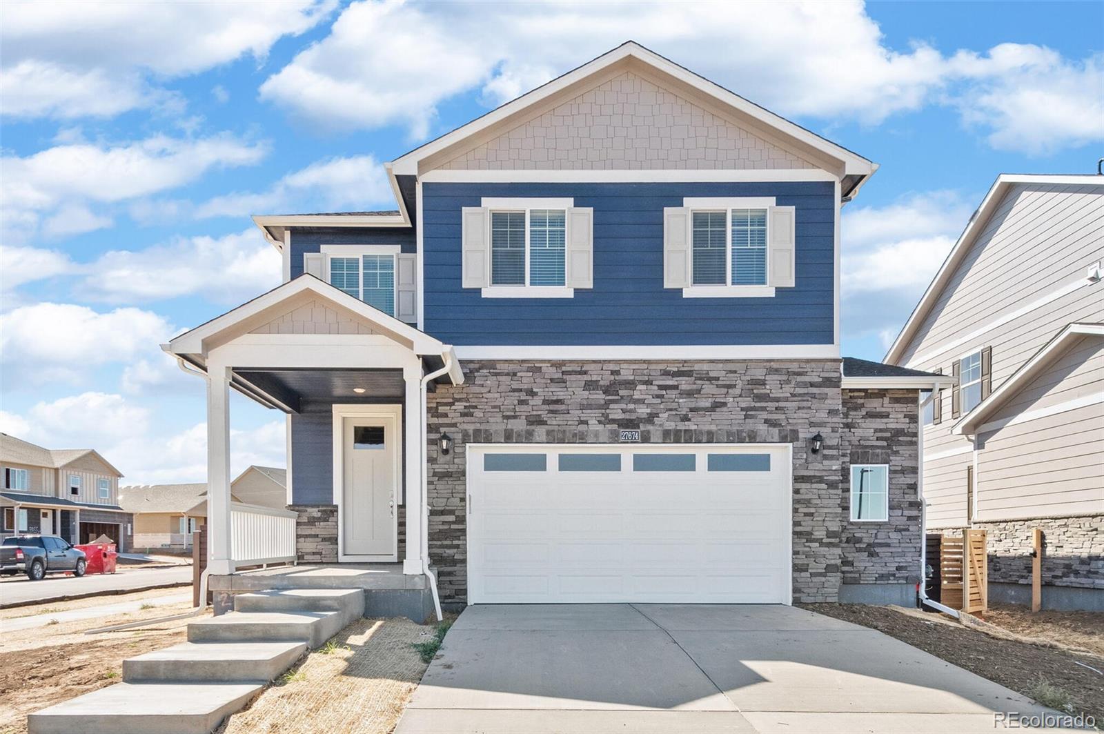 a front view of a house with a garage