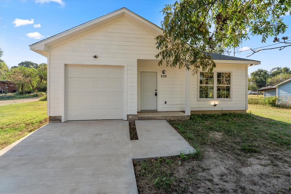 front view of a house with a yard