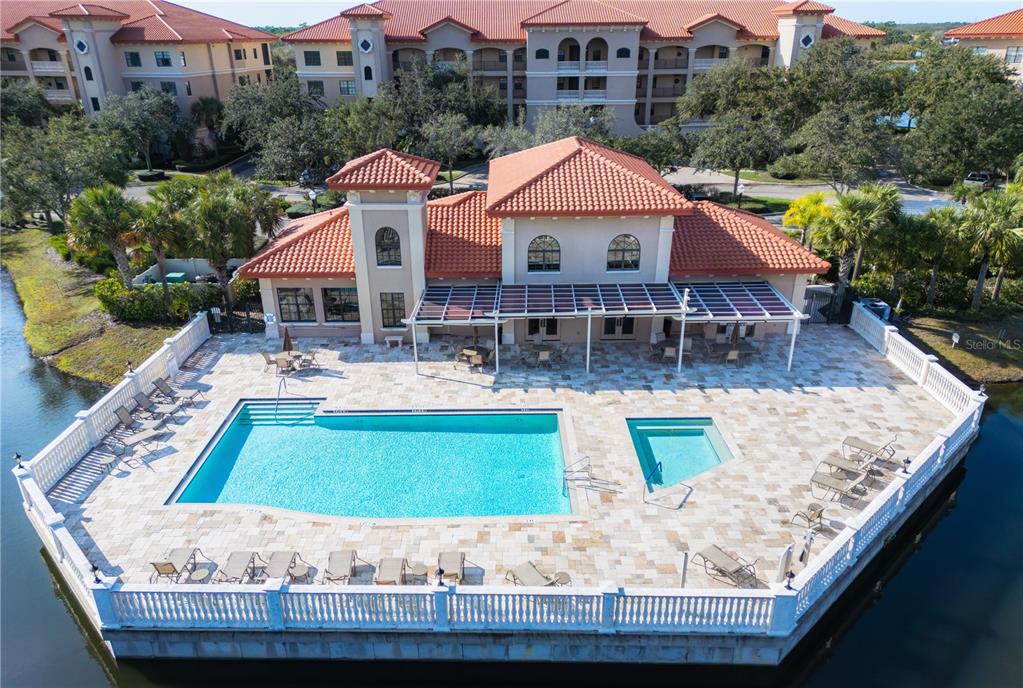 a front view of house with yard and swimming pool