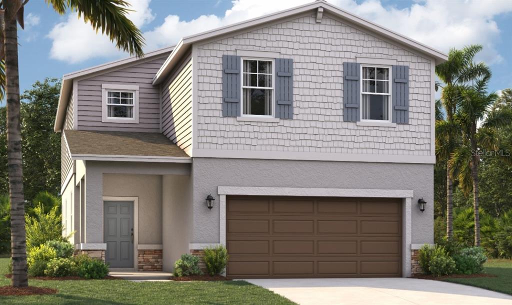 a front view of a house with a yard and garage