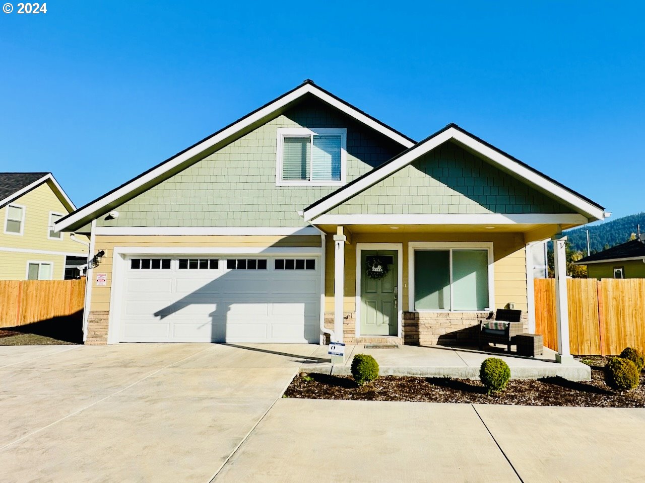 a front view of a house with garage