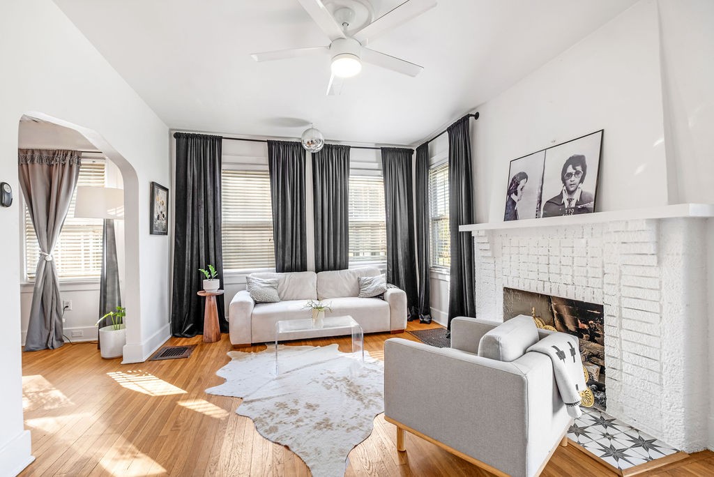 a living room with furniture and a fireplace