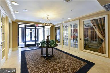 a room with furniture and large windows