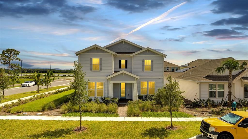 a front view of a house with a yard