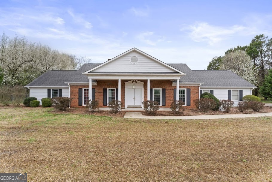 front view of a house with a yard