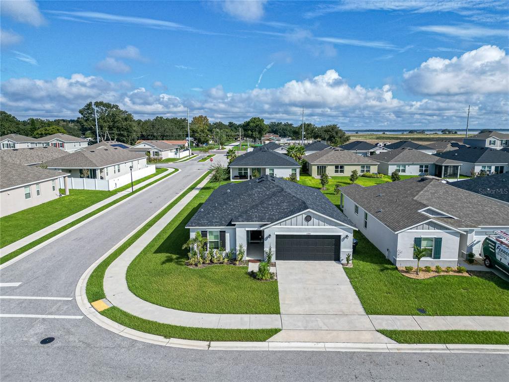 a aerial view of a house with a big yard