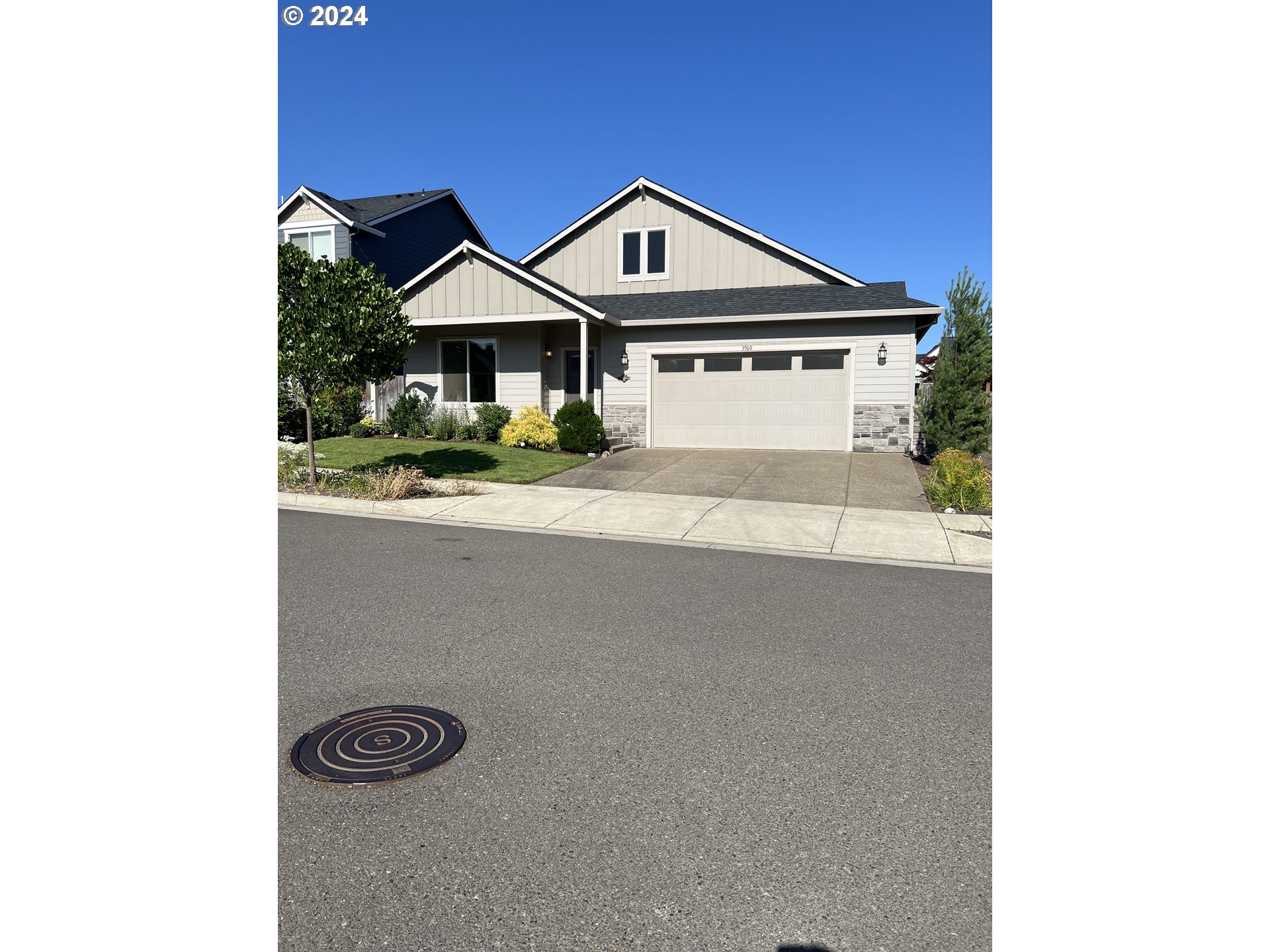 a front view of a house with yard