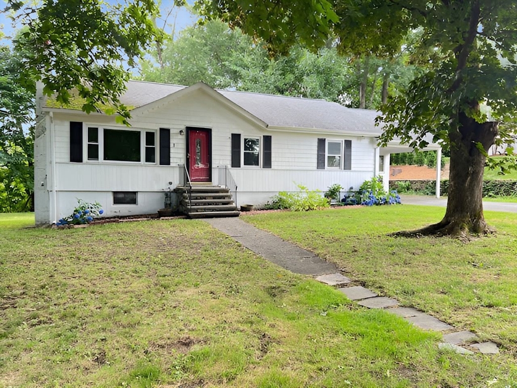 a front view of a house with a yard