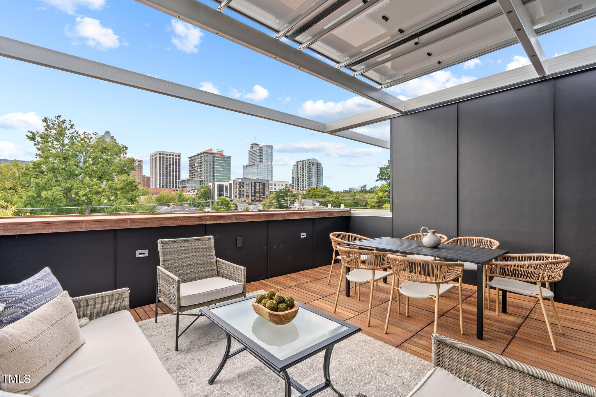 a outdoor space with a table and chairs