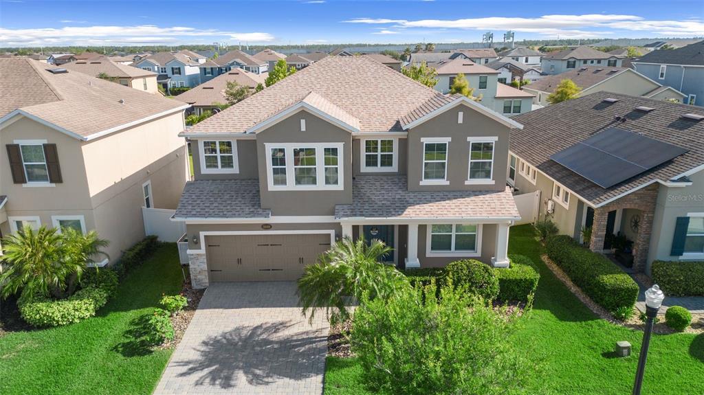 a aerial view of a house with a yard