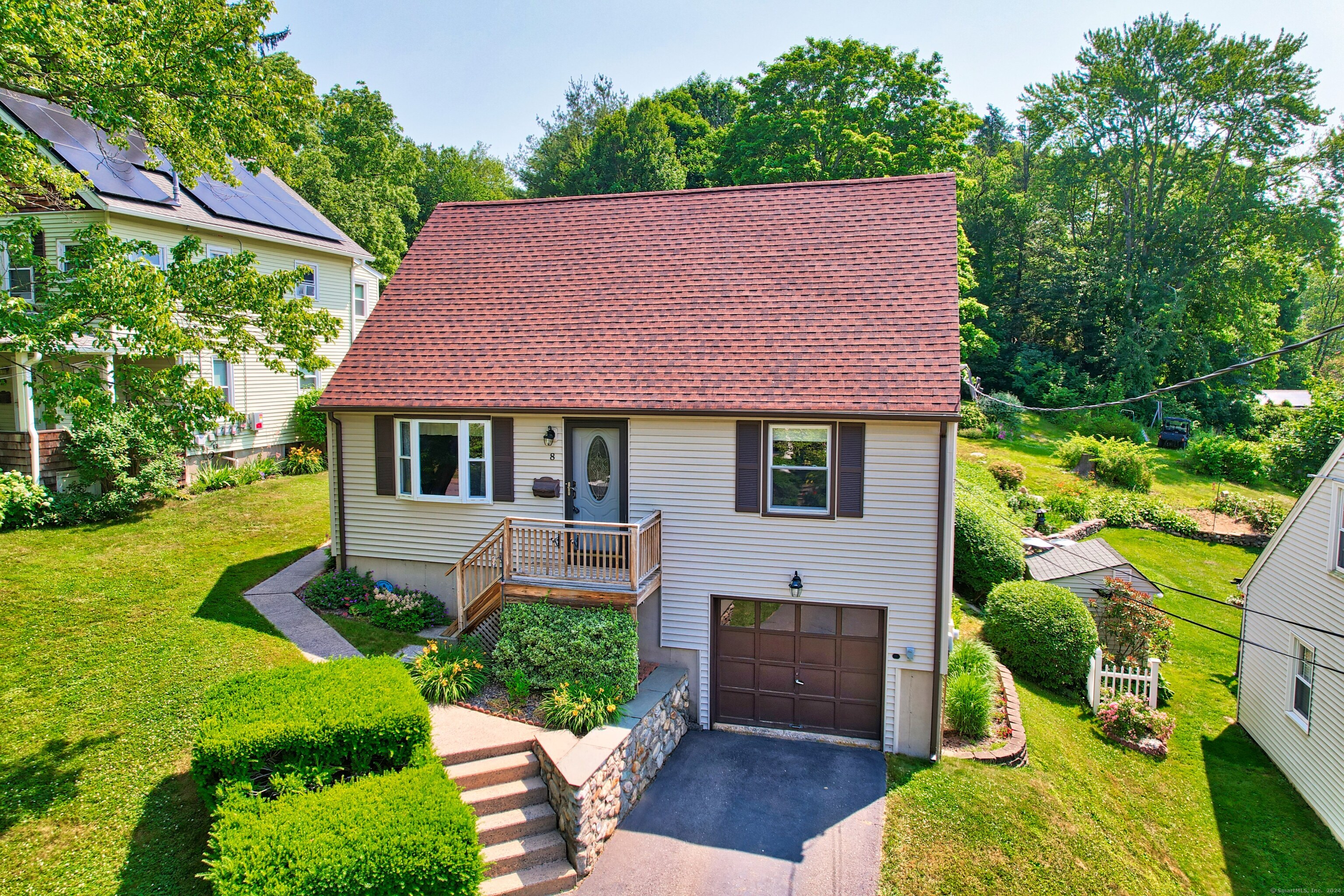 a view of house with a yard