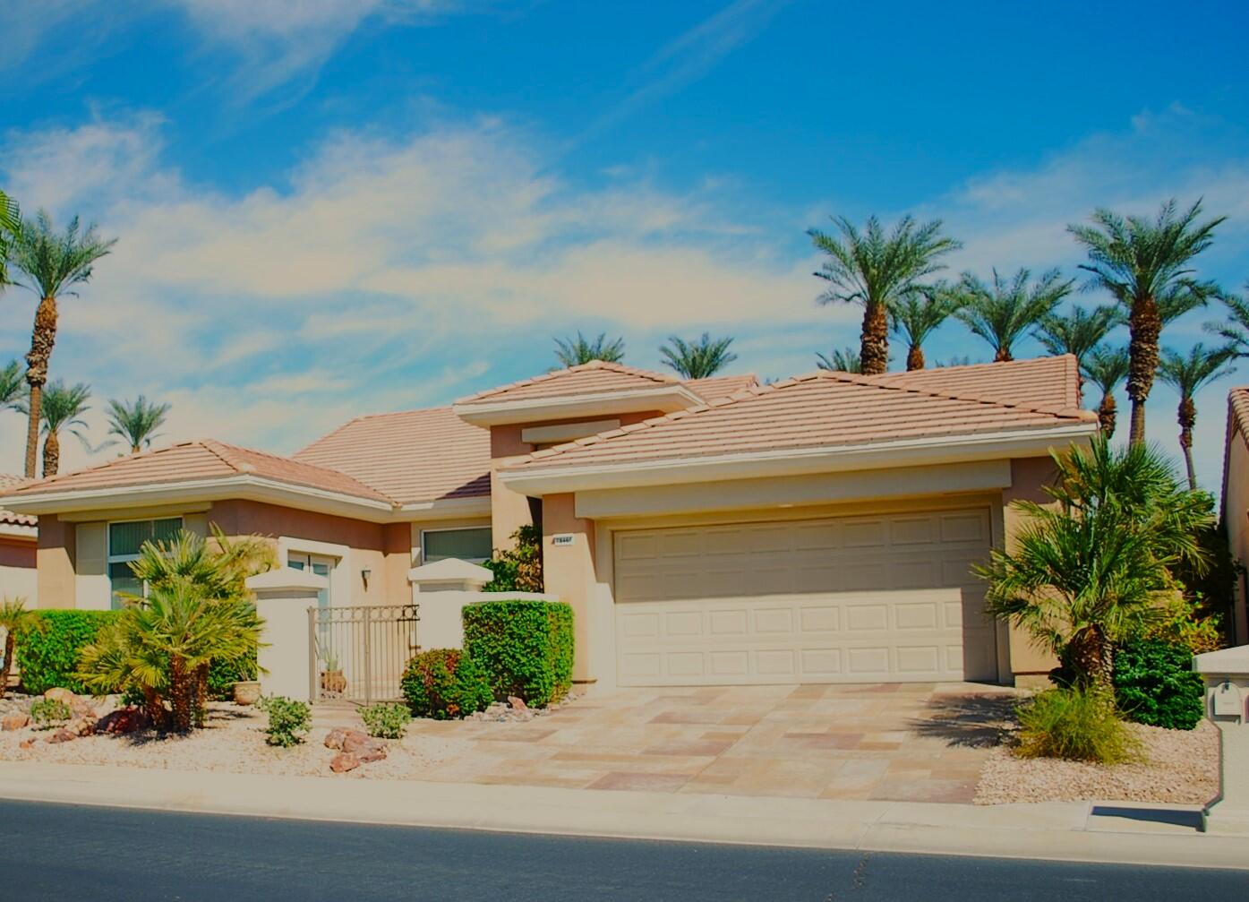 a front view of a house with a garage