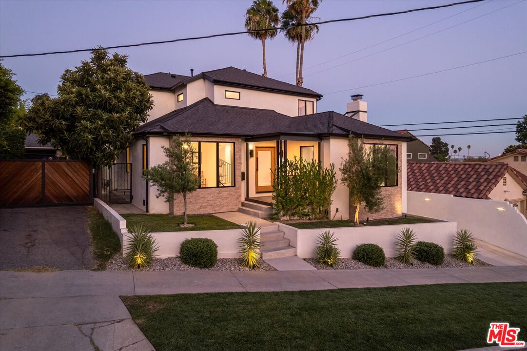 a view of a house with backyard outdoor seating and kitchen