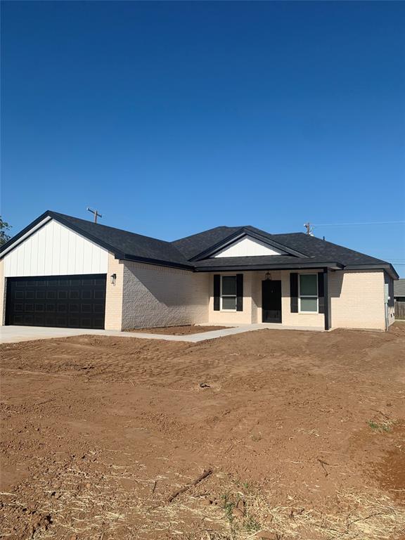 a front view of a house with yard