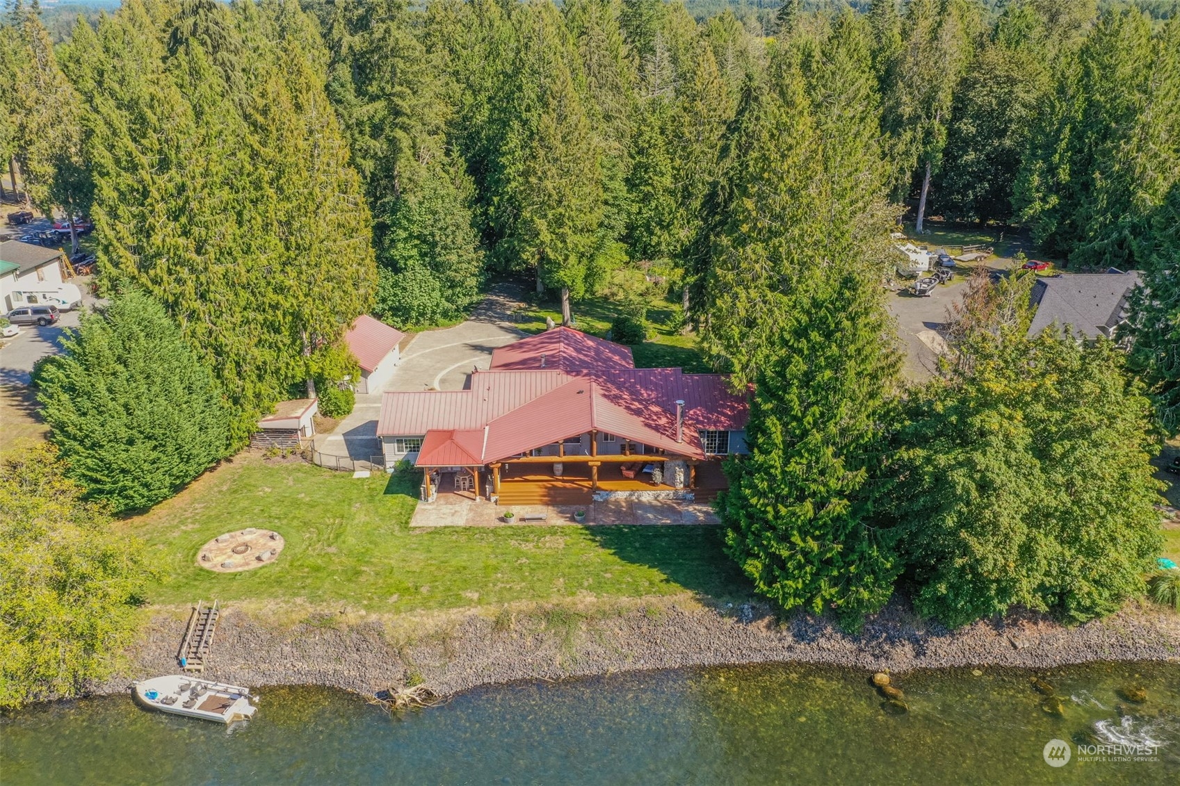 an aerial view of a house with garden space sitting space and swimming pool