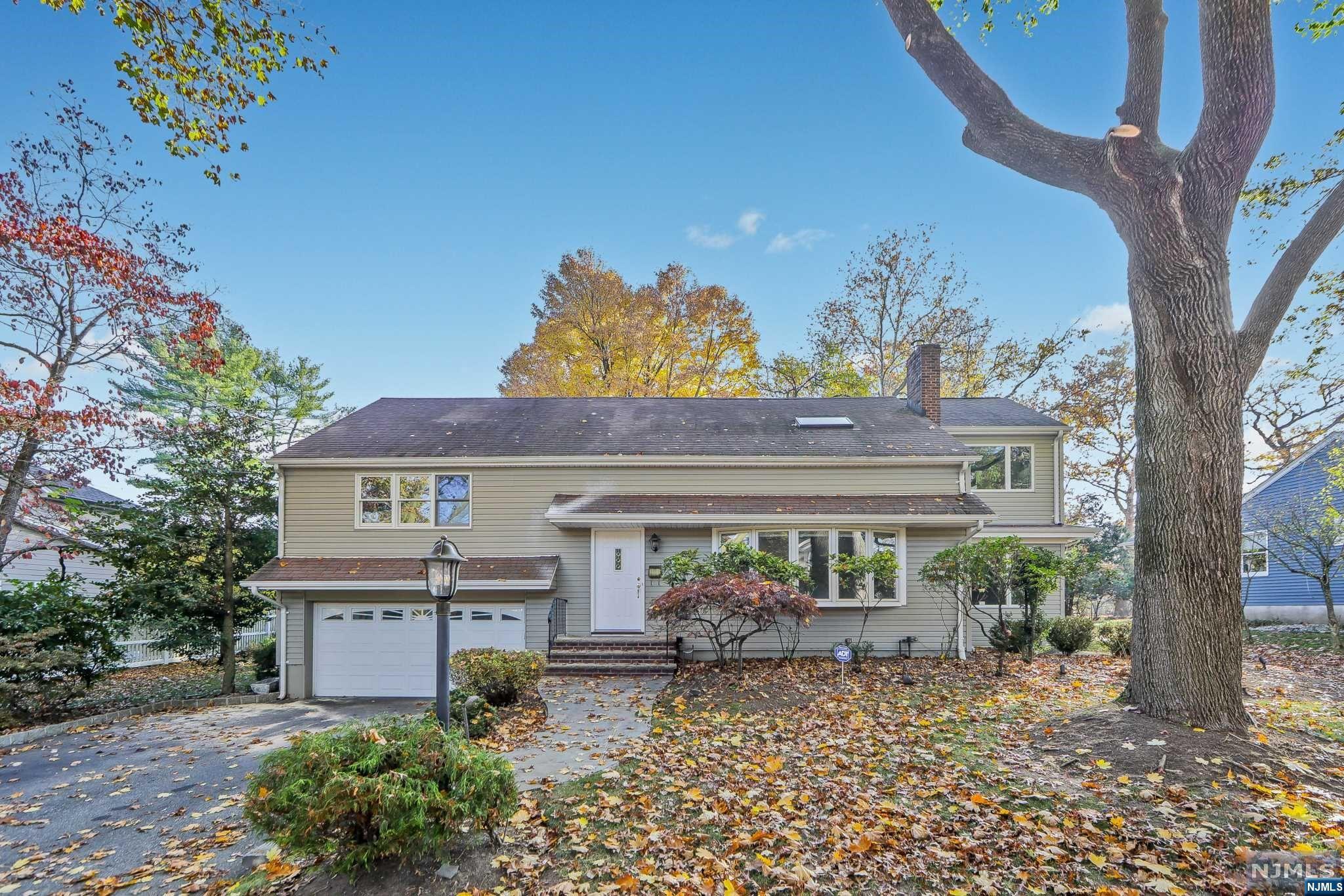 front view of a house with a garden