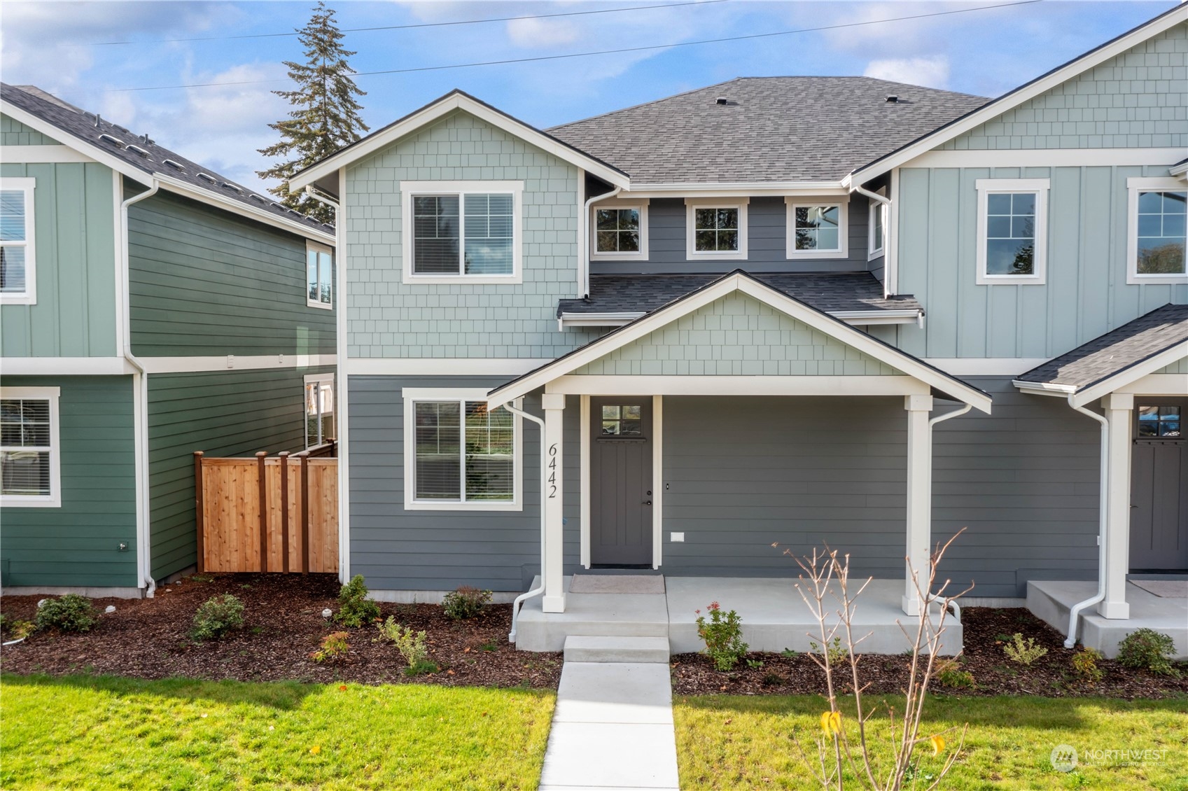 a view of house with yard outdoor seating area