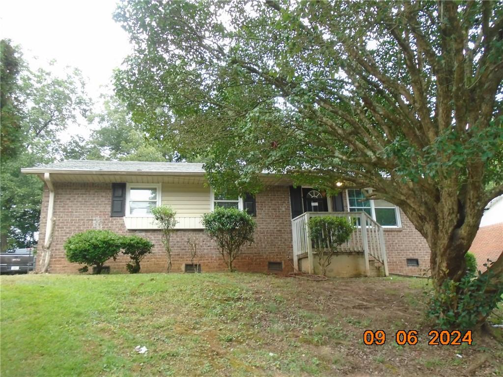 front view of a house with a yard