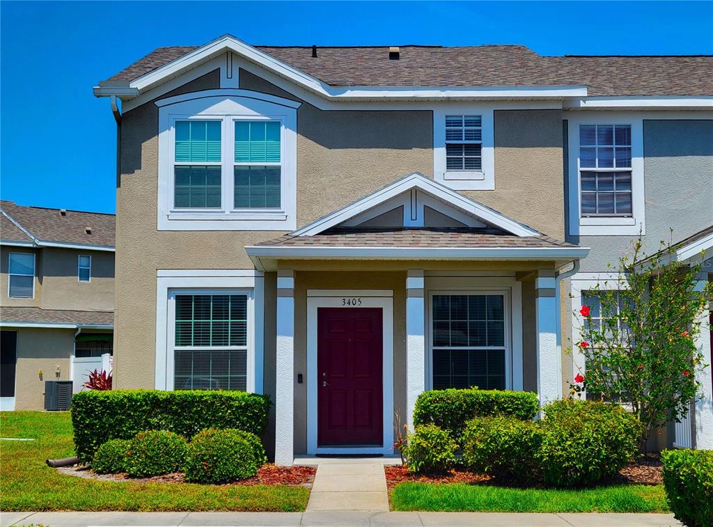 a front view of a house with garden