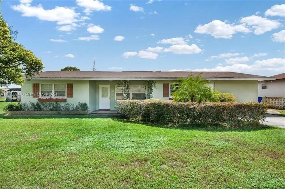 a view of a house with a back yard