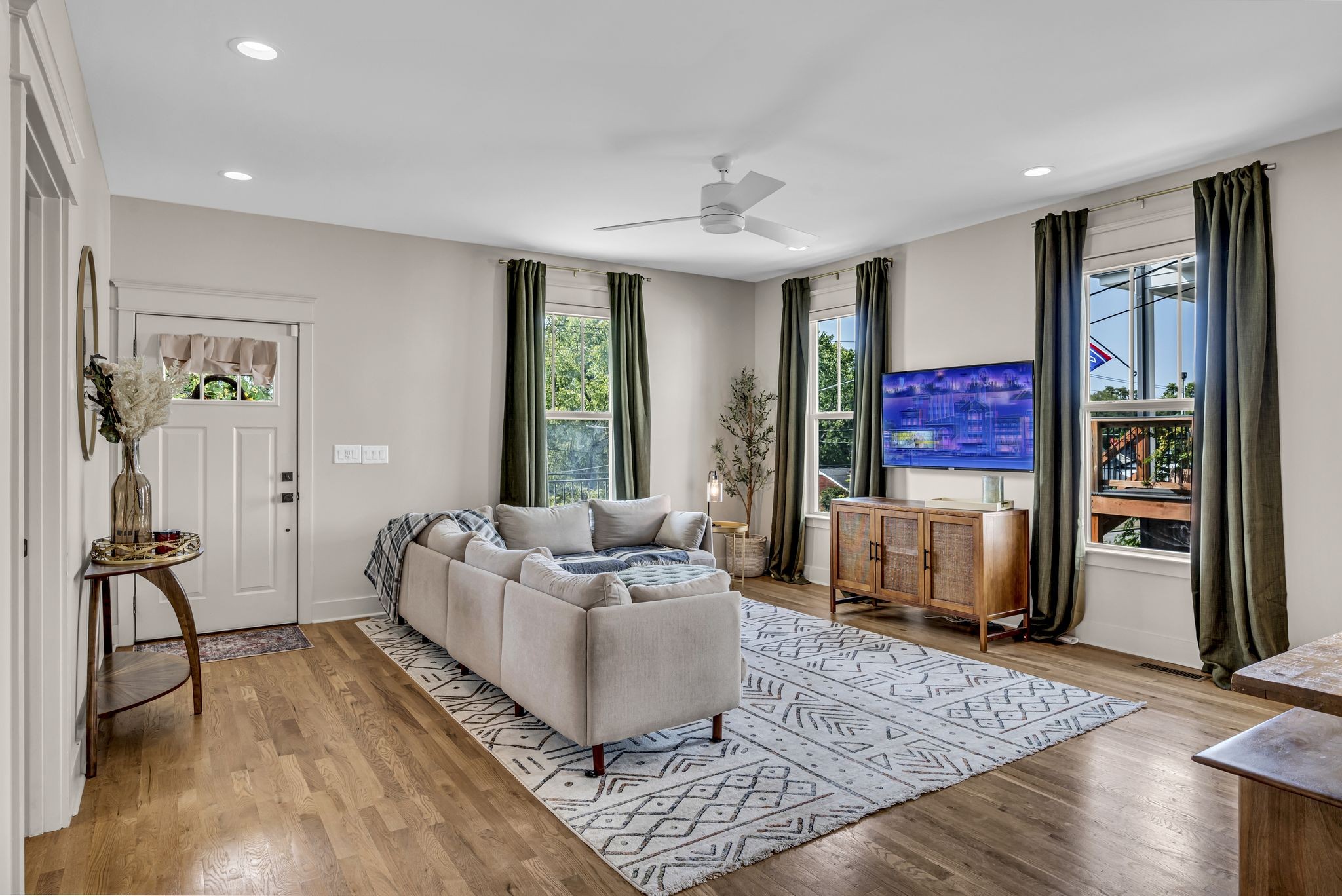 a living room with furniture and a rug