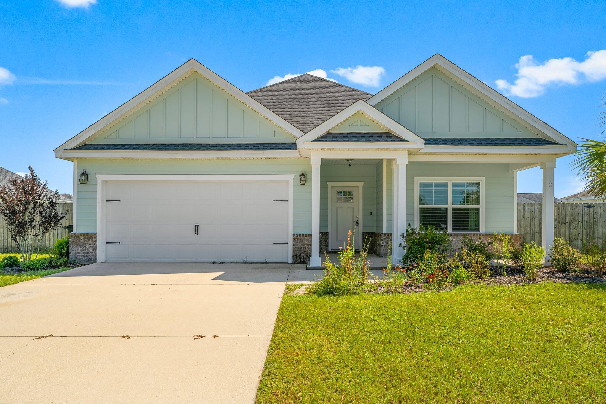 a front view of a house with yard