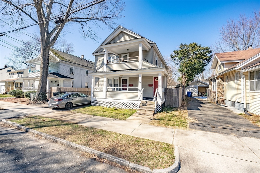 a view of a house with cars park